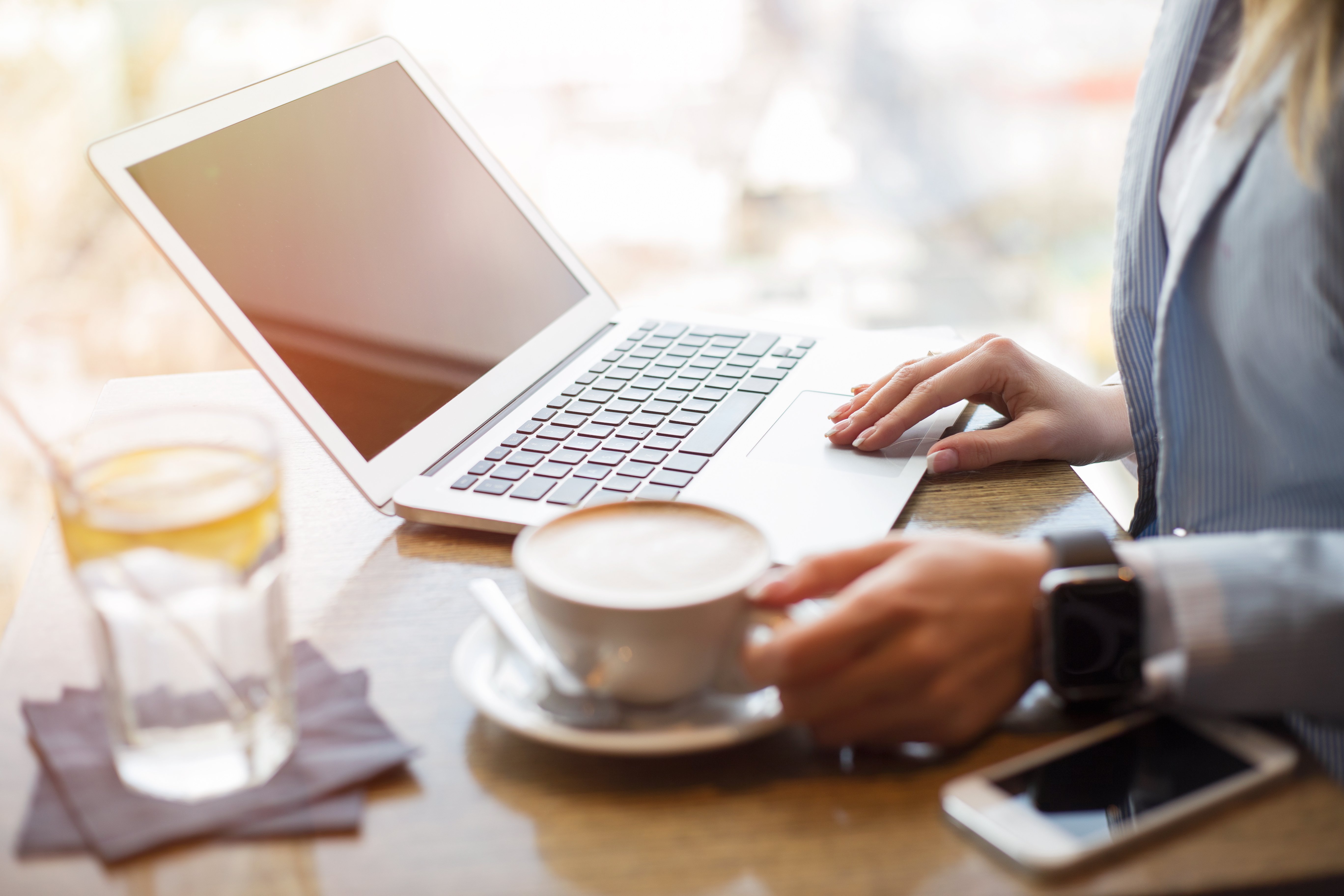 Woman in cafe working on portable computer